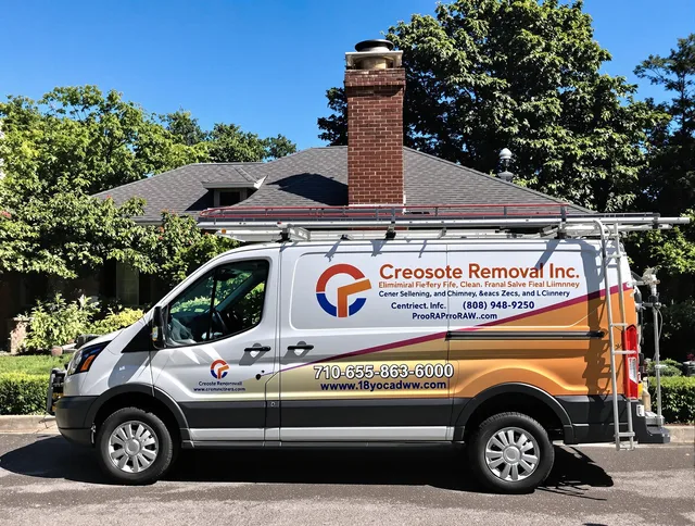 Longmeadow Chimney Sweep technician removing creosote safely in Longmeadow, MA