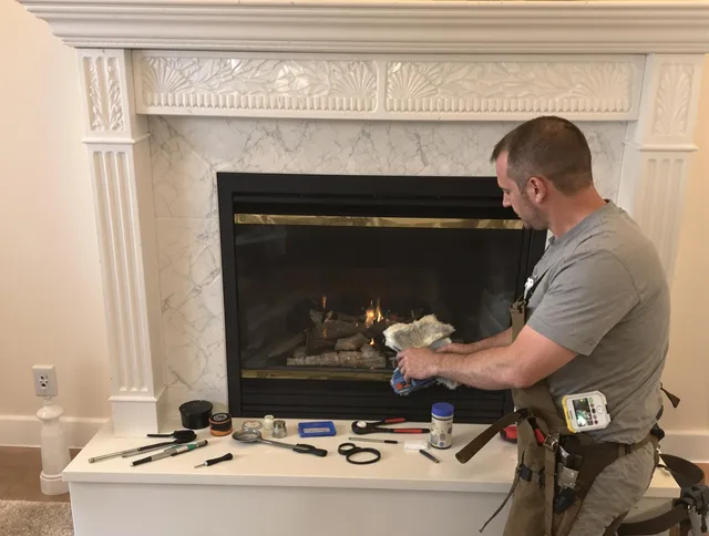 Longmeadow Chimney Sweep performing fireplace maintenance in Longmeadow, MA